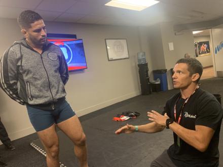 Referee Jason Herzog going over the rules with Josh Jones