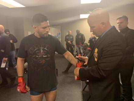 CSAC inspector taping Josh's gloves