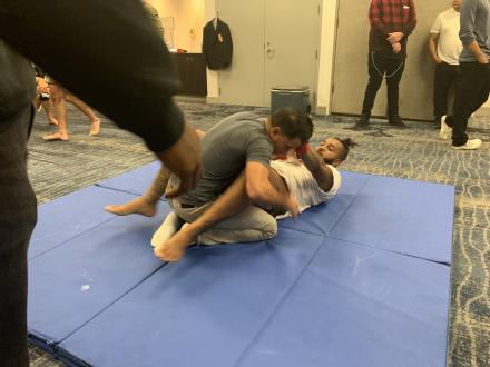 Jason Carbajal helping fighters warm up