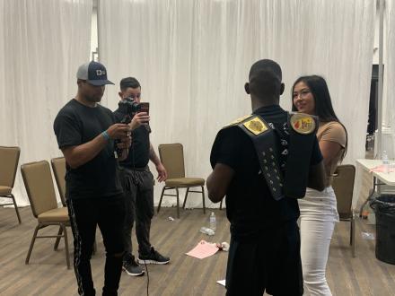 had George filming Alex Wendling interviewing Jonathan Powell after the fights