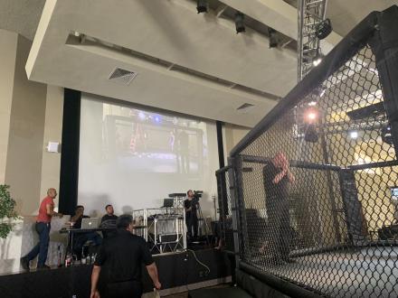 The big screen behind the cage